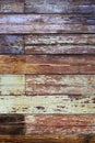 Texture, old grungy paint-striped wood slatted wall covered with peeling paint