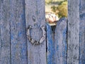 Texture of old iron horseshoe and wooden surface of the gate Royalty Free Stock Photo