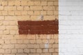 Brick wall with old red and white paint. Royalty Free Stock Photo