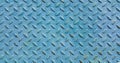 Old metal diamond plate covered with blue paint Royalty Free Stock Photo