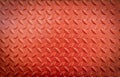 Texture of old metal diamond plates that have been red painted Royalty Free Stock Photo
