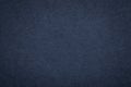 Texture of old navy blue paper background, closeup. Structure of dense dark denim cardboard Royalty Free Stock Photo