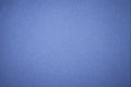 Texture of old navy blue paper background, closeup. Structure of dense dark denim cardboard. Royalty Free Stock Photo