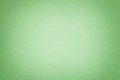 Texture of old green paper background, closeup. Structure of dense light olive cardboard Royalty Free Stock Photo