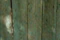 Texture of old painted shabby rustic wooden fence made of planks Royalty Free Stock Photo