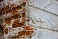 Texture of old red brick wall. Grunge background brick wall. White painted rough wall surface. The corner of the building Royalty Free Stock Photo