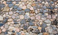 Texture of old rock wall for background. A castle wall of multicolored stones or blocks. Stacked stone wall Royalty Free Stock Photo