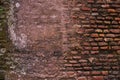 The texture of an old rustic wall is covered with red stucco. Abstract background for design Royalty Free Stock Photo