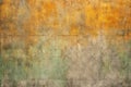 Texture of old rustic wall covered with yellow and green stucco Royalty Free Stock Photo