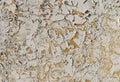 Texture of old rustic wall covered with yellow stucco. Abstract background for design Royalty Free Stock Photo