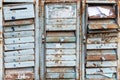 Texture of Old and rusty mailboxes with locks and figures