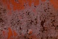 Texture of old rusty metal wall covered by old damaged red paint Royalty Free Stock Photo