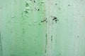 The texture of the old shabby oxidized metal, iron with the expanded peeling green peeling paint and patterns