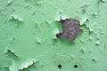 The texture of the old shabby oxidized metal, iron with the expanded peeling green peeling paint and patterns