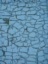 Texture of old spotted painted wall, covered with cracks close-up. Craquelure on old surface