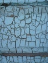Texture of old spotted painted wall  covered with cracks close-up. Craquelure on old surface Royalty Free Stock Photo