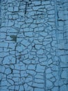 Texture of old spotted painted wall  covered with cracks close-up. Craquelure on old surface Royalty Free Stock Photo