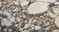 The texture of an old stone wall with pieces of white marble and gray pebbles, with cracks and veins Royalty Free Stock Photo