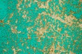Texture of the old surface of a wooden wall painted with green paint, a layer of paint flakes and falls behind the tree Royalty Free Stock Photo