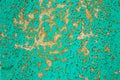 Texture of the old surface of a wooden wall painted with green paint, a layer of paint flakes and falls behind the tree Royalty Free Stock Photo