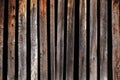 A texture of old thin crooked wooden planks