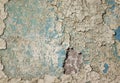 texture of old wall with many layers of peeling paint and plaster