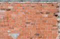 Texture of old wall wall with broken clay bricks orange