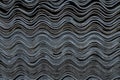 Texture of old wavy slate on the roof. Royalty Free Stock Photo