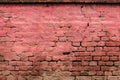 Texture of an old weathered damaged brick wall as background