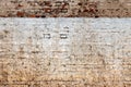 Texture of an old weathered damaged brick wall as background