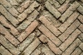 Texture of old weathered red brick sidewalk.