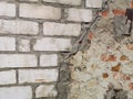 Texture of old white and red brick and crack in the wall at the junction of different brickwork. background brick wall Royalty Free Stock Photo