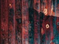 The texture of old wood covered with red and blue paint is old, faded, burst Royalty Free Stock Photo