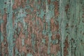 Texture of old wood with cracked paint of green color Royalty Free Stock Photo