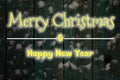 Texture of an old wooden fence with snow and a festive inscription. Winter night horizontal background Royalty Free Stock Photo