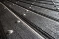 Texture of old wooden plank door with iron rivets