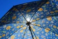 Texture of a open beach umbrella with translucent rays