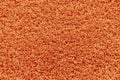 Texture of a orange carpet with a large naps