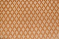 Texture of orange fabric with rombic pattern