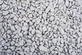 Texture: Pale grey rock chippings / aggregate background. 4