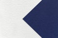 Texture of paper white background, half two colors with navy blue arrow, macro. Structure of dense craft cardboard Royalty Free Stock Photo