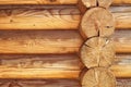 Texture parallel folded treated timber. Ancient technology building of Russian log hut, wood house cottages and churches Royalty Free Stock Photo