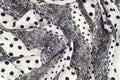 Texture, pattern, background. Cloth cotton. White fabric, painted with black polka dots, black lace. Black White Grunge Spots Fab Royalty Free Stock Photo