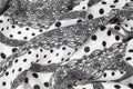 Texture, pattern, background. Cloth cotton. White fabric, painted with black polka dots, black lace. Black White Grunge Spots Fab Royalty Free Stock Photo