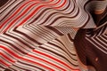 Texture, pattern, collection, silk fabric, brown background with a striped pattern of white and red lines, the Spanish theme, Royalty Free Stock Photo