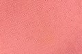 Texture and pattern of a knitted pink wool sweater. Royalty Free Stock Photo