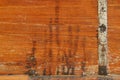 Texture photo of rustic weathered wood with rusty metal bar