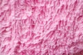 Texture of pile of pink fabric. Macro. Closeup. on a wh