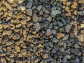 Texture of a pile of small black pebbles, river stones Royalty Free Stock Photo