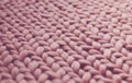 Texture of pink knit blanket. Large knitting. Plaid merino wool. Royalty Free Stock Photo